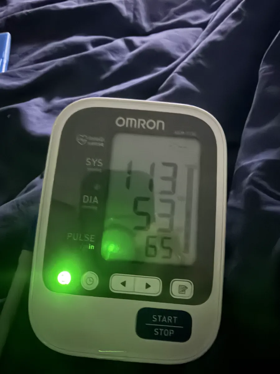 Omron blood pressure monitor reading 113 over 53, pulse 65